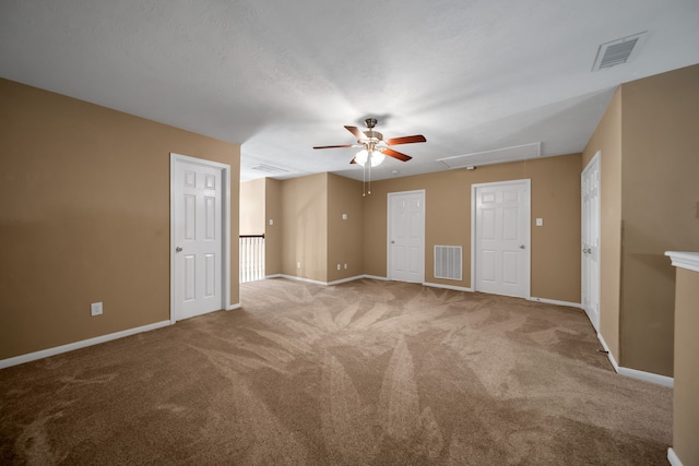 31322 Capella Cir, Tomball, TX 77375 - empty room featuring attic access, a ceiling fan, and carpet