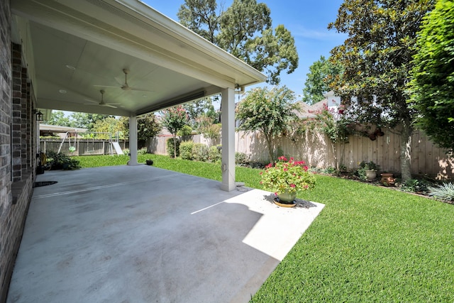 31322 Capella Cir, Tomball, TX 77375 - fenced backyard featuring ceiling fan and a patio