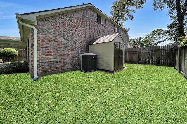 31322 Capella Cir, Tomball, TX 77375 - view of property exterior with brick siding, a fenced backyard, and an outdoor structure