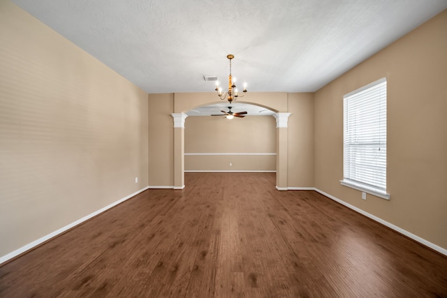 31322 Capella Cir, Tomball, TX 77375 - unfurnished room featuring ornate columns, arched walkways, wood finished floors, a chandelier, and ceiling fan