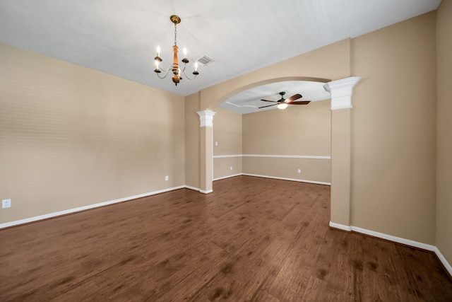 31322 Capella Cir, Tomball, TX 77375 - spare room with ceiling fan, arched walkways, dark wood finished floors, decorative columns, and a chandelier