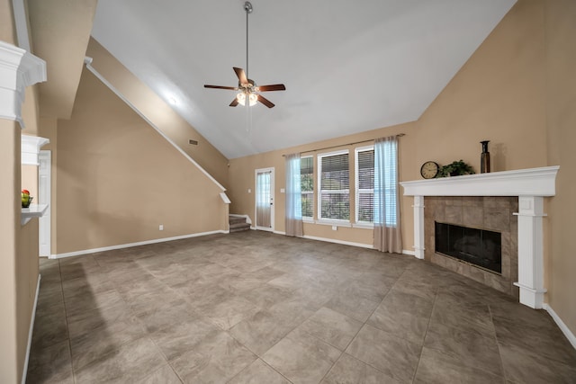 31322 Capella Cir, Tomball, TX 77375 - unfurnished living room with a ceiling fan, a fireplace, stairway, and high vaulted ceiling