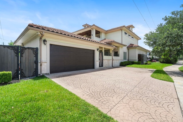 9761 Westview Dr, Houston, TX 77055 - mediterranean / spanish house with curved driveway, an attached garage, a tile roof, and stucco siding