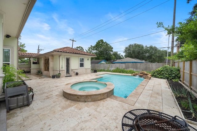 9761 Westview Dr, Houston, TX 77055 - view of swimming pool with a patio, a pool with connected hot tub, a fenced backyard, and an outbuilding