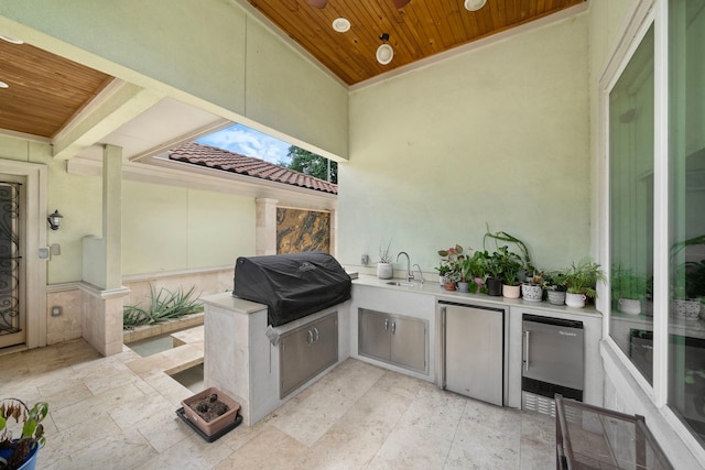9761 Westview Dr, Houston, TX 77055 - view of patio featuring beverage cooler and an outdoor kitchen
