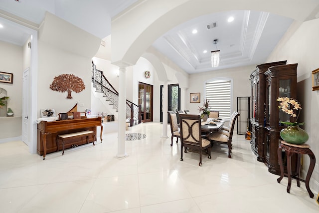 9761 Westview Dr, Houston, TX 77055 - dining area with decorative columns, recessed lighting, stairs, arched walkways, and a raised ceiling