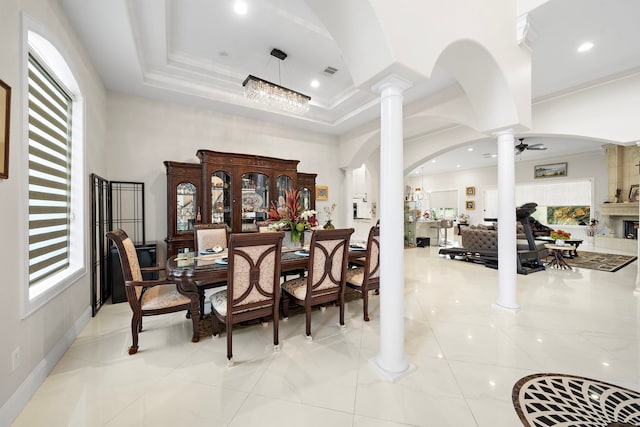 9761 Westview Dr, Houston, TX 77055 - dining area featuring ornate columns, arched walkways, light tile patterned flooring, recessed lighting, and crown molding