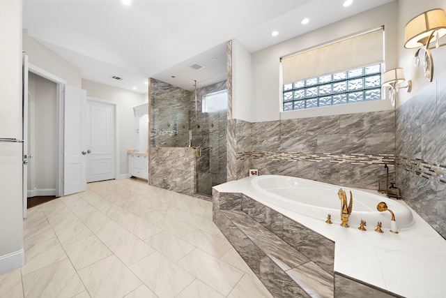 9761 Westview Dr, Houston, TX 77055 - full bathroom with recessed lighting, a marble finish shower, a garden tub, marble look tile flooring, and vanity