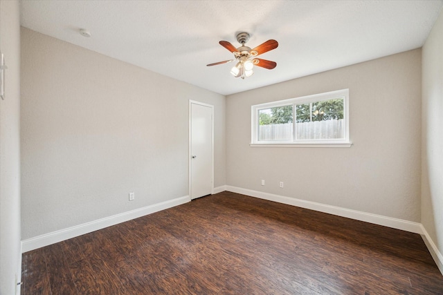 2902 Triway Ln, Houston, TX 77043 - spare room featuring dark wood-style flooring, ceiling fan, and a smoke detector