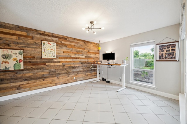 2902 Triway Ln, Houston, TX 77043 - unfurnished living room with wood walls, a chandelier, and a textured ceiling