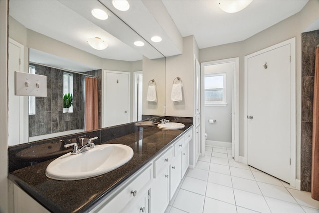 2902 Triway Ln, Houston, TX 77043 - bathroom with double vanity, tile patterned floors, and curtained shower