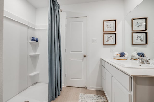 253 Douglas Hills Dr, Magnolia, TX 77354 - full bath with vanity, wood finished floors, and a stall shower