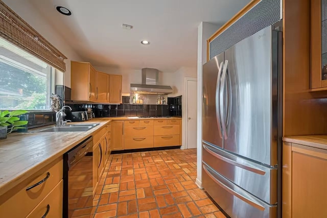 13115 Apple Tree Rd, Houston, TX 77079 - kitchen featuring freestanding refrigerator, dishwasher, wall chimney exhaust hood, brick flooring, and backsplash