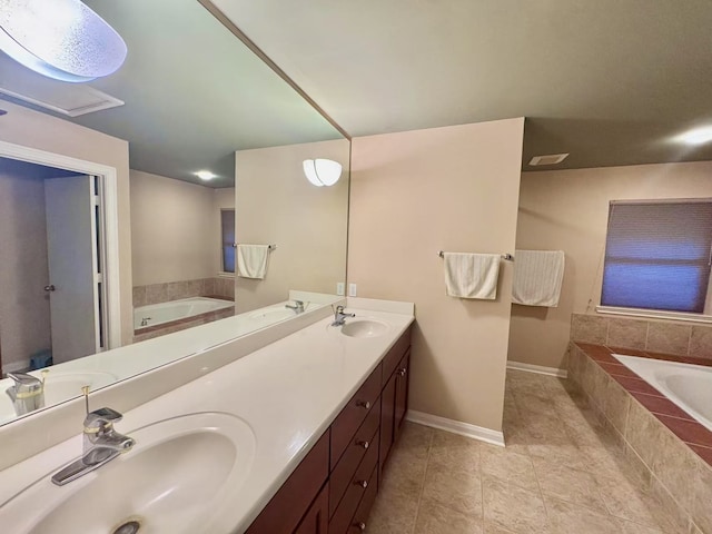 13115 Apple Tree Rd, Houston, TX 77079 - bathroom with a garden tub, double vanity, and tile patterned flooring