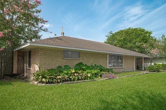 13115 Apple Tree Rd, Houston, TX 77079 - view of side of home featuring a yard and roof with shingles