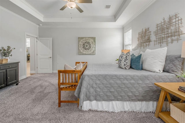 9868 Albert Dr, Iola, TX 77861 - carpeted bedroom featuring a raised ceiling, ornamental molding, and a ceiling fan
