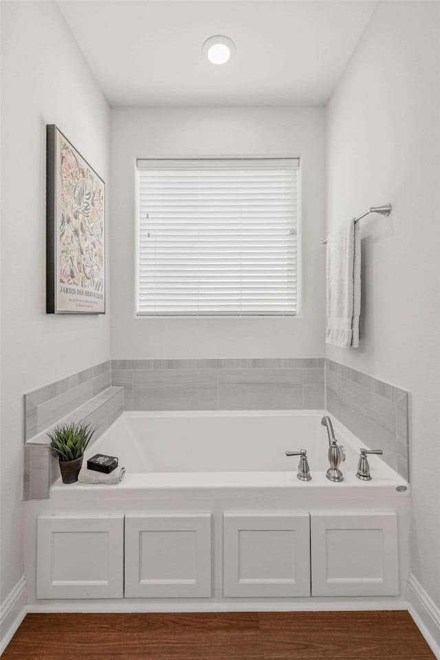9868 Albert Dr, Iola, TX 77861 - full bathroom featuring a bath and baseboards