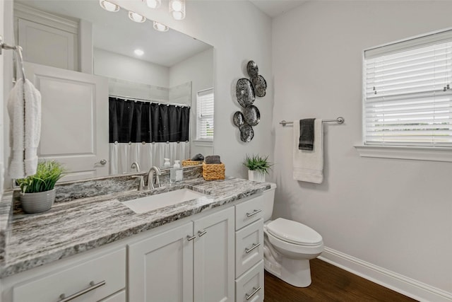 9868 Albert Dr, Iola, TX 77861 - bathroom with vanity, wood finished floors, and curtained shower