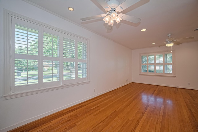 5049 De Milo Dr, Houston, TX 77092 - empty room with a ceiling fan, light wood-style floors, and recessed lighting