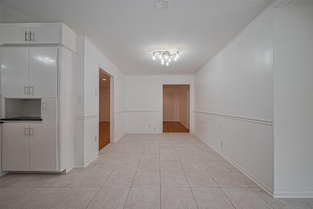 5049 De Milo Dr, Houston, TX 77092 - unfurnished dining area featuring light tile patterned flooring and baseboards
