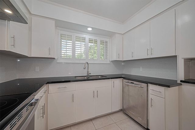 5049 De Milo Dr, Houston, TX 77092 - kitchen with stainless steel appliances, ventilation hood, white cabinets, light tile patterned floors, and crown molding
