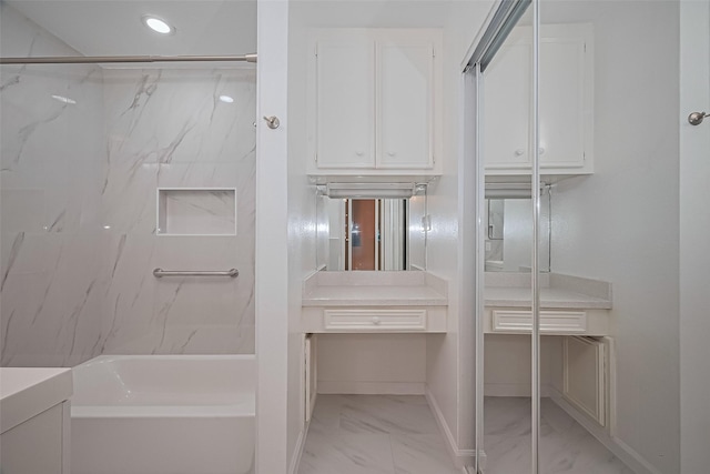 5049 De Milo Dr, Houston, TX 77092 - bathroom featuring marble look tile flooring, vanity,  shower combination, and recessed lighting