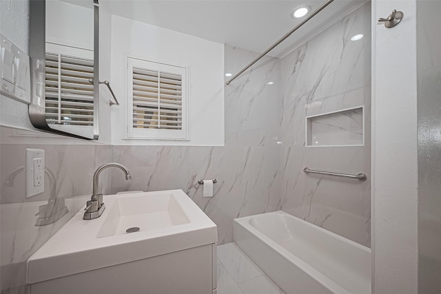 5049 De Milo Dr, Houston, TX 77092 - bathroom featuring vanity, shower / bath combination, recessed lighting, tasteful backsplash, and tile walls