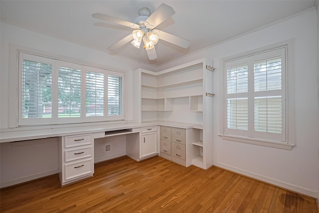 5049 De Milo Dr, Houston, TX 77092 - unfurnished office with built in study area, plenty of natural light, light wood finished floors, and a ceiling fan