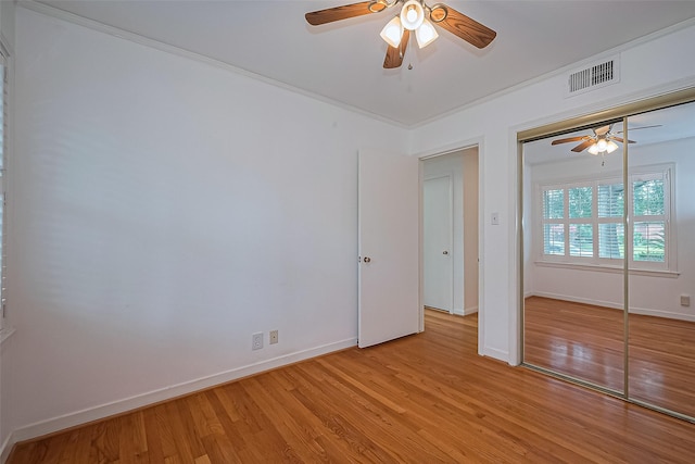 5049 De Milo Dr, Houston, TX 77092 - unfurnished bedroom with light wood finished floors, ceiling fan, and a closet