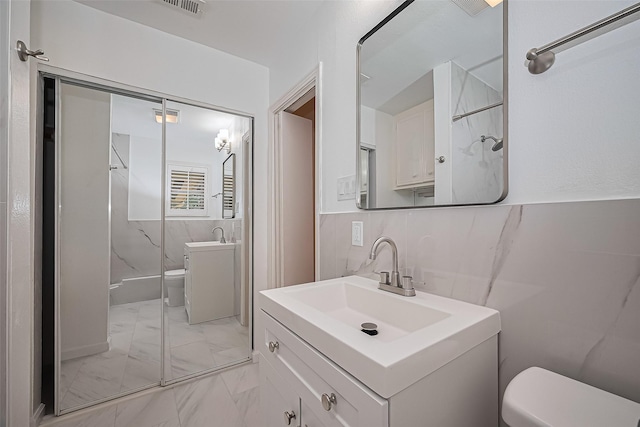 5049 De Milo Dr, Houston, TX 77092 - full bath featuring marble look tile flooring, a shower, and vanity