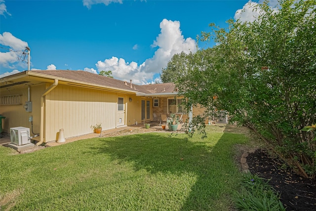 5049 De Milo Dr, Houston, TX 77092 - rear view of house with a lawn