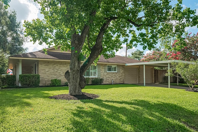 5049 De Milo Dr, Houston, TX 77092 - rear view of house with a yard, a garage, an attached carport, and brick siding