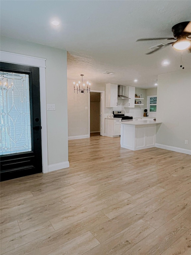 4521 Kingsbury St, Houston, TX 77021 - unfurnished living room with a chandelier, light wood finished floors, and a ceiling fan