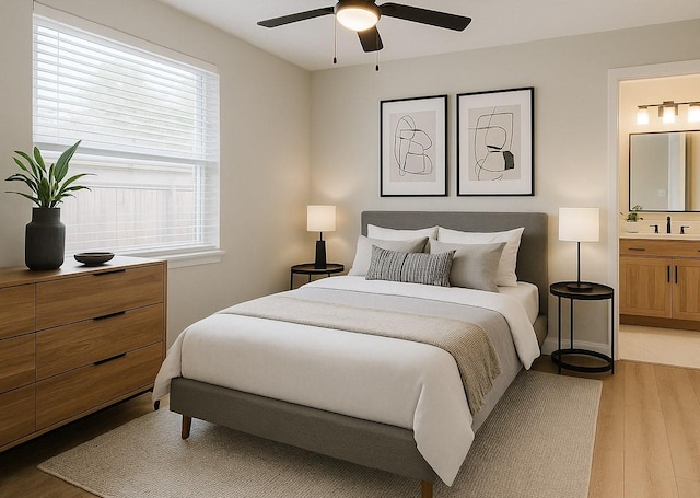 4521 Kingsbury St, Houston, TX 77021 - bedroom featuring light wood finished floors, ensuite bathroom, and a ceiling fan