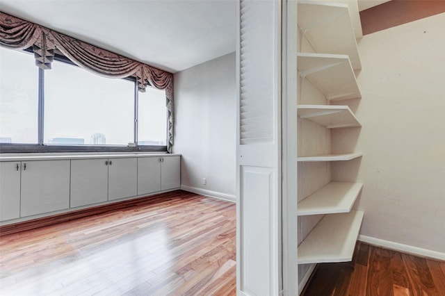 49 Briar Hollow Ln Unit 1801, Houston, TX 77027 - walk in closet with wood finished floors