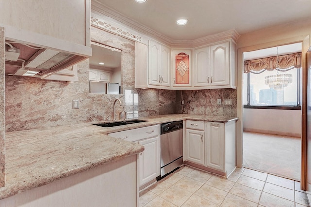 49 Briar Hollow Ln Unit 1801, Houston, TX 77027 - kitchen with stainless steel dishwasher, a chandelier, light tile patterned floors, light stone counters, and recessed lighting