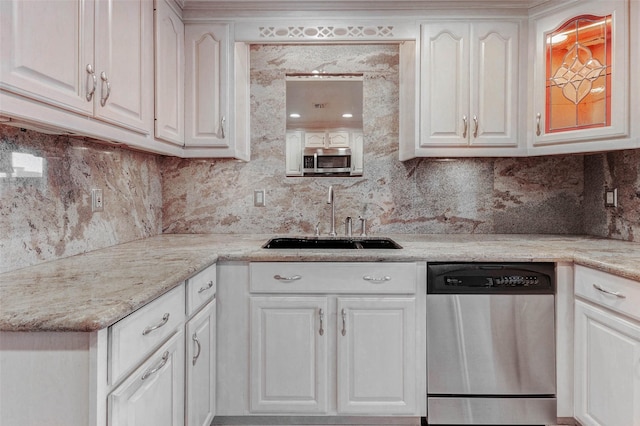 49 Briar Hollow Ln Unit 1801, Houston, TX 77027 - kitchen featuring stainless steel appliances, white cabinets, tasteful backsplash, and light stone countertops
