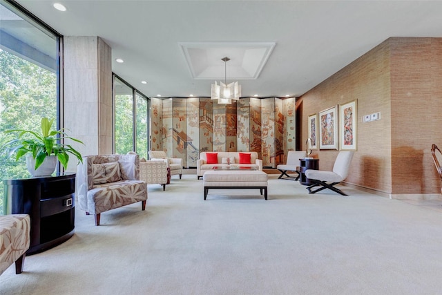 49 Briar Hollow Ln Unit 1801, Houston, TX 77027 - carpeted living room featuring floor to ceiling windows and recessed lighting