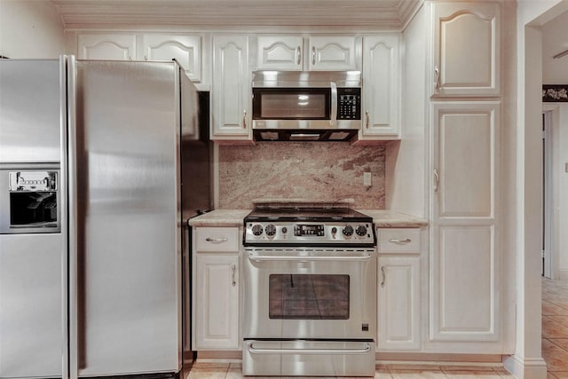 49 Briar Hollow Ln Unit 1801, Houston, TX 77027 - kitchen featuring stainless steel appliances, backsplash, and light tile patterned floors