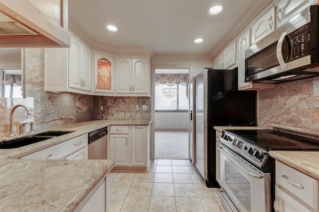 49 Briar Hollow Ln Unit 1801, Houston, TX 77027 - kitchen with appliances with stainless steel finishes, white cabinets, light stone counters, tasteful backsplash, and recessed lighting
