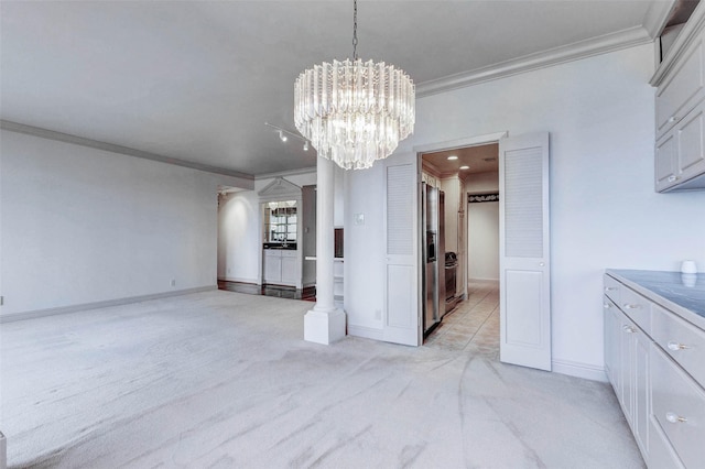 49 Briar Hollow Ln Unit 1801, Houston, TX 77027 - unfurnished dining area with ornamental molding, light carpet, and a chandelier