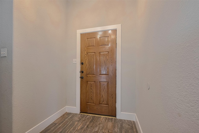 10527 Friars Hl, Houston, TX 77070 - doorway with dark wood-type flooring and baseboards