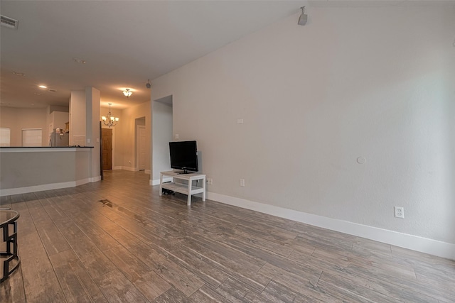 10527 Friars Hl, Houston, TX 77070 - unfurnished living room with a chandelier and wood finished floors