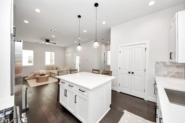 5502 Wheatley St Unit B, Houston, TX 77091 - kitchen with a ceiling fan, open floor plan, dark wood finished floors, white cabinetry, and recessed lighting