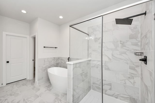 5502 Wheatley St Unit B, Houston, TX 77091 - full bathroom featuring a freestanding tub, a walk in shower, marble finish flooring, recessed lighting, and tile walls