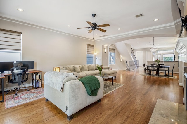 1013 Crocker St, Houston, TX 77019 - living room featuring arched walkways, ceiling fan, wood finished floors, an office area, and ornamental molding
