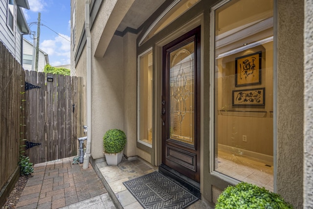 1013 Crocker St, Houston, TX 77019 - doorway to property featuring stucco siding