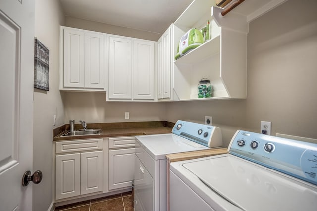 1013 Crocker St, Houston, TX 77019 - washroom with independent washer and dryer, cabinet space, and dark tile patterned flooring