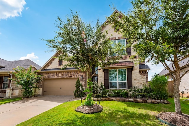 14062 Dunsmore Landing Dr, Houston, TX 77059 - view of property hidden behind natural elements featuring stone siding, concrete driveway, a front yard, and an attached garage