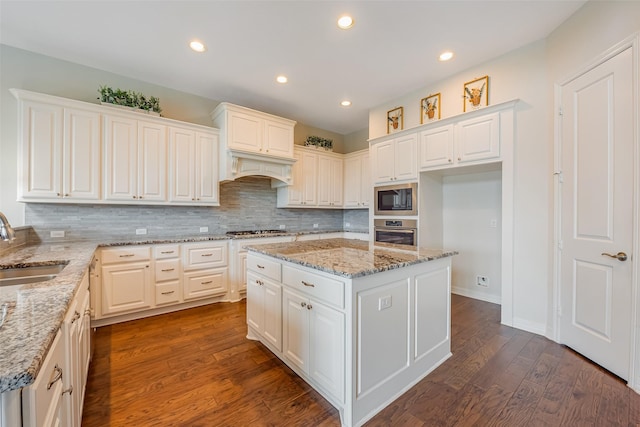14062 Dunsmore Landing Dr, Houston, TX 77059 - kitchen featuring appliances with stainless steel finishes, tasteful backsplash, white cabinetry, and recessed lighting